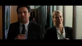 man and woman walking in hallway — Now You See Me