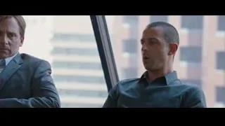 two men in office with cityscape view — The Big Short