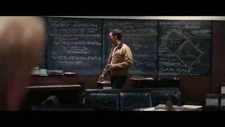 Man speaking at blackboard in dimly lit classroom — Interstellar