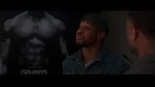Man in beanie looking up at gorilla silhouette — Creed 3