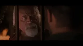 elderly man looking through bars — Gladiator