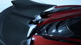 Red sports car parked in empty parking garage — Sports Cars