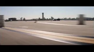 Black sports car driving on highway — Ford v Ferrari