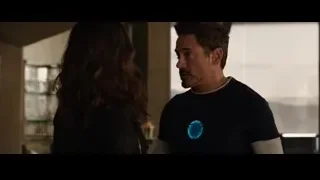 man and woman in conversation in room — Iron Man 3