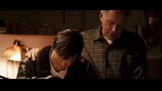 two men in dimly lit room — Jobs