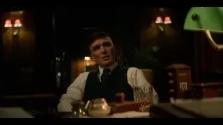 young man sitting at table in dimly lit restaurant — Peaky Blinders
