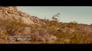 Muscle car driving on desert road — Furious Seven