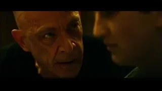 close-up of bald man's serious face — Whiplash