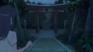 person walking to red torii gate at night — Your Name
