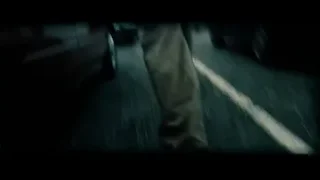 person walking on wet road — Superman: Man of Steel