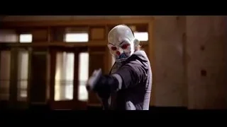 person wearing clown mask holding gun — Batman: The Dark Knight