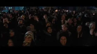 man in suit on stage addressing crowd — Now You See Me