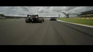 Formula One cars racing with spectators — F1