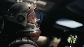 man in futuristic helmet in control room — Interstellar