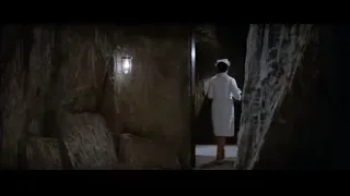 man walking through dark tunnel — Bruce Lee: Enter The Dragon