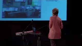 woman giving presentation on stage — Screened Out