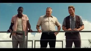 three men on balcony with man holding gun — Jurassic World