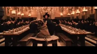 People in black robes in large hall — Harry Potter and the Philosophers Stone