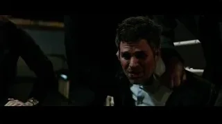 Man in suit in distress in dark room — Now You See Me 2
