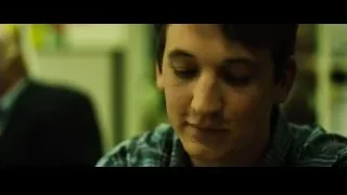 young man smiling in plaid shirt — Whiplash