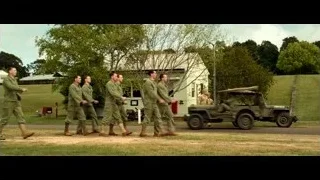 military men walking on dirt road — Hacksaw Ridge