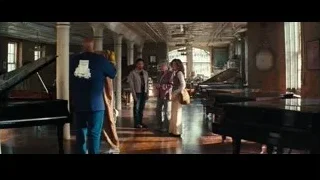 man and woman walking in piano room — The Secret Life of Walter Mitty
