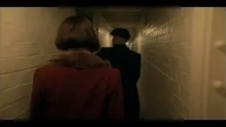 man and woman walking in narrow hallway — Peaky Blinders
