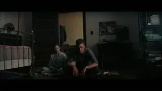 man and woman sitting on cluttered floor — Interstellar