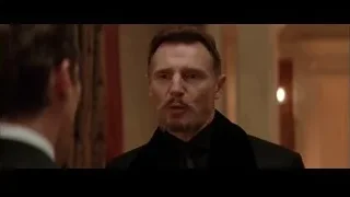 Man in suit speaking to another man — Batman