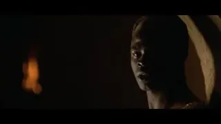 African-American woman's serious face in dim room — Gladiator