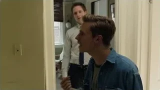 Two young men talking in hallway — Suits