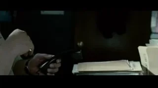 man talking on telephone at desk — Limitless