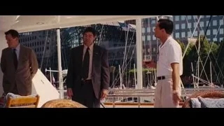 two men conversing on yacht deck — The Wolf Of Wall Street