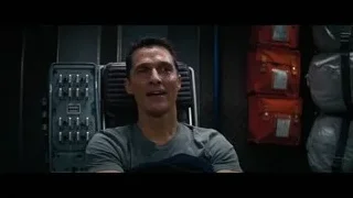 Man sitting in chair with red bags — Interstellar