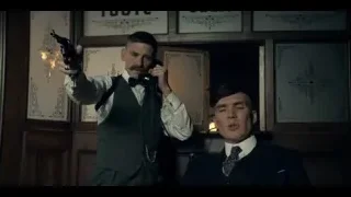 Two men conversing with gun in ornate room — Peaky Blinders