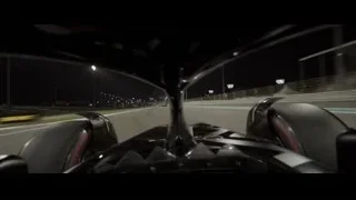 Formula One car on track at night — F1