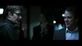 Two men facing each other in dim room — Batman: The Dark Knight