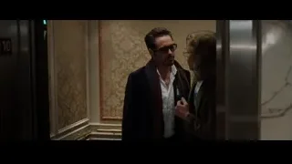 two men in elevator with number 10 — Iron Man 3