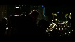 People looking through telescope on rooftop at night — Batman: The Dark Knight