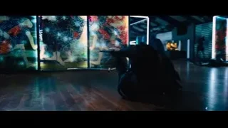 Person with gun in dimly lit room — John Wick: Chapter 4
