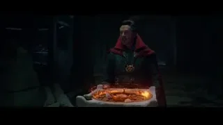Man in red cloak at stone altar in dark room — Spiderman: No Way Home