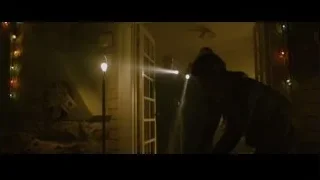 two men in dimly lit room with Christmas lights — The Social Network