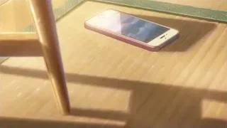 pink iPhone on patterned rug — Your Name