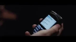 Hand holding black BlackBerry phone — The Big Short