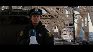 police officer with megaphone at Eiffel Tower — Batman: The Dark Knight Rises