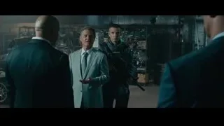 three men in garage with a gun — Furious Seven