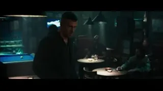 man deep in thought at dimly lit bar — Deadpool