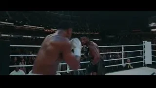 two boxers fighting in ring with Creed-Dame screen — Creed 3