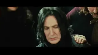 Man in black coat and hat with group — Harry Potter and the Philosophers Stone