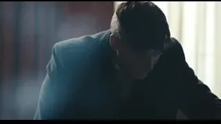 young man crouching in dark room — Peaky Blinders